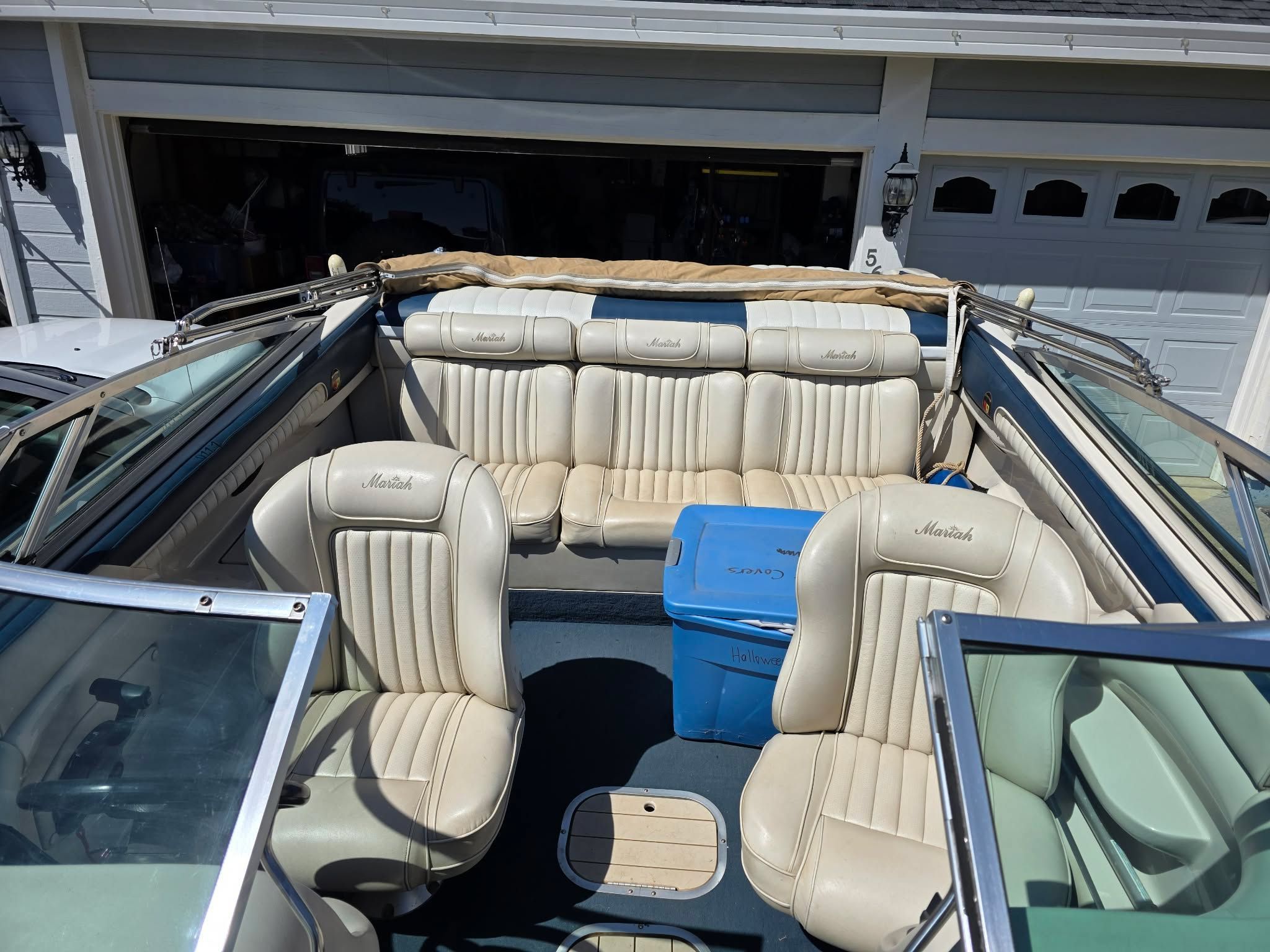 Interior of a 1996 Mariah Talari boat with beige leather seats.