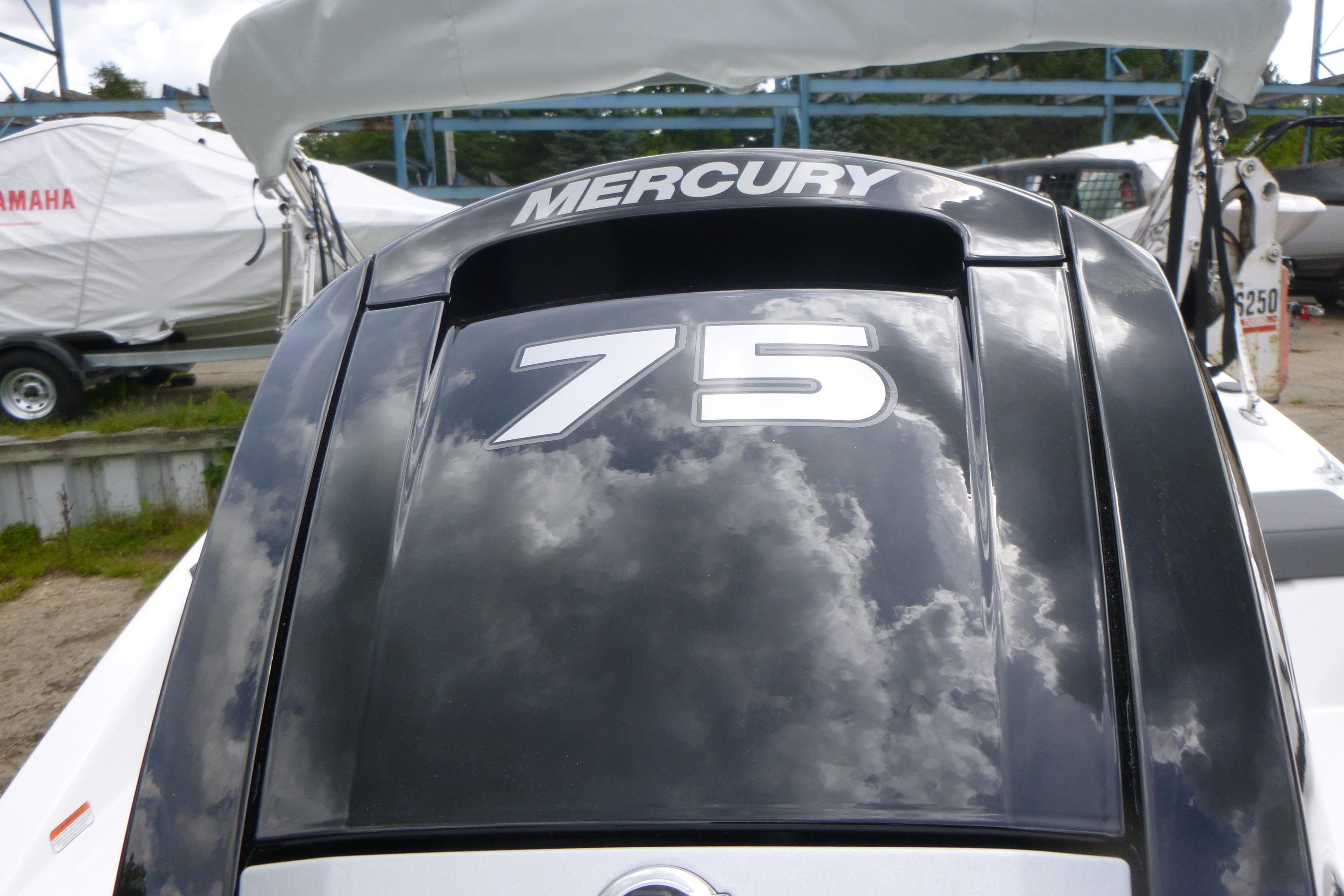 2026 Tahoe T16 boat with Mercury 75 engine, reflecting cloudy sky.