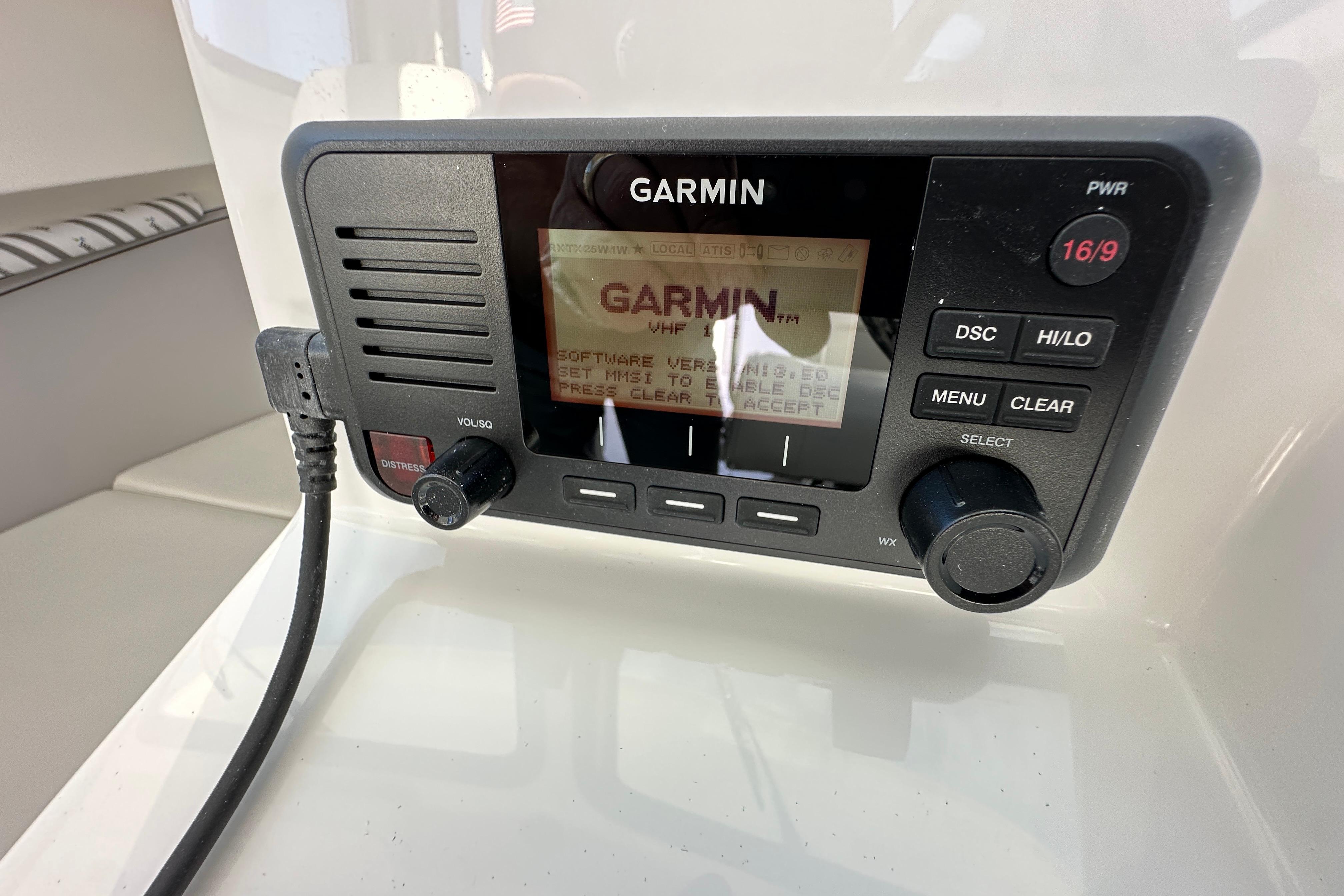 Garmin marine radio on 2026 Parker 227 Explorer boat dashboard.