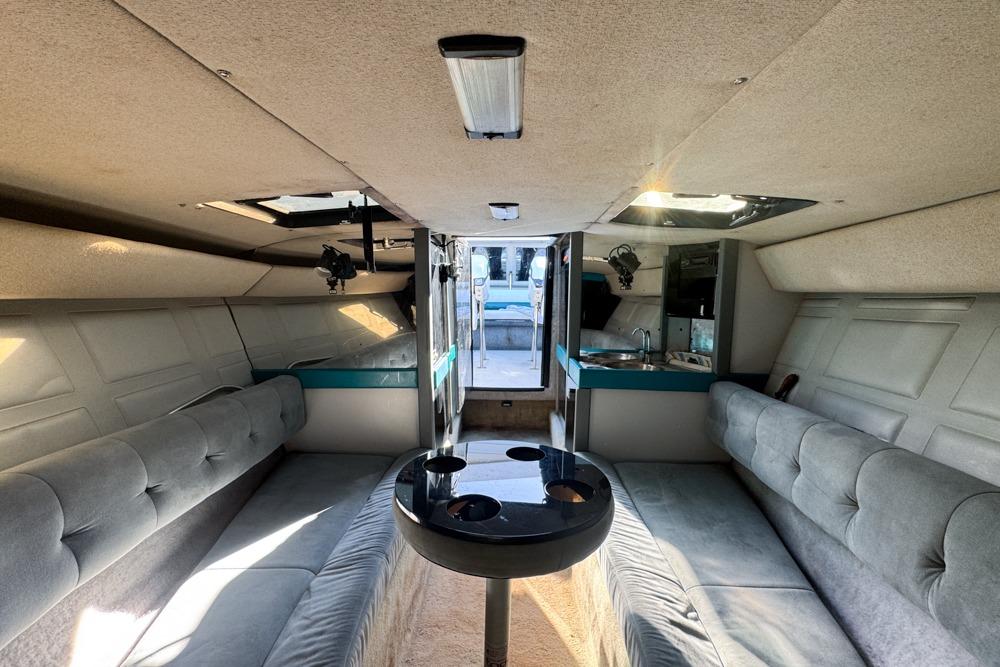 Interior of a 1989 Formula 292 SR-1 boat with seating and kitchenette.