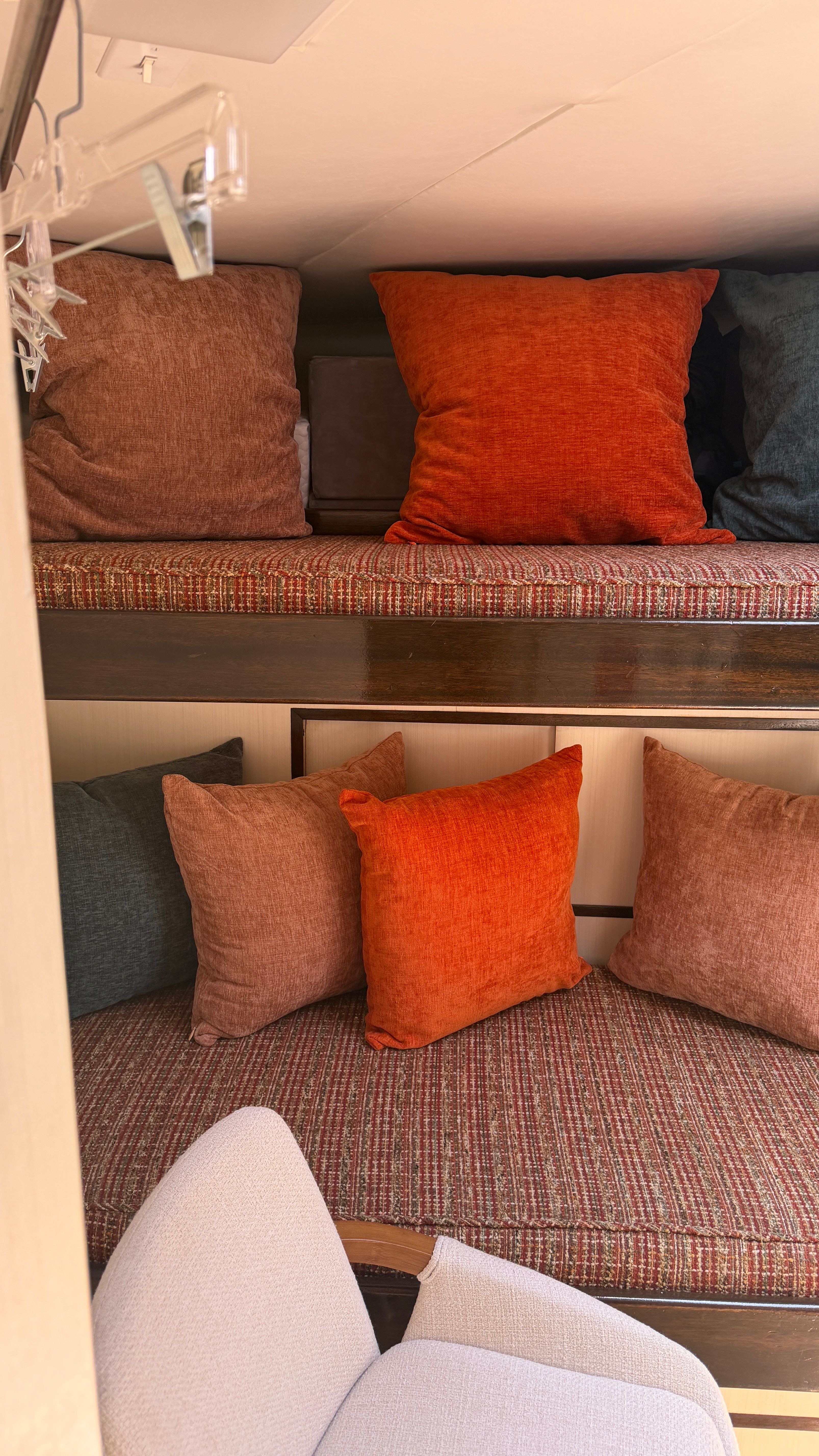 Interior of a 1966 Drake Yachtfisher with colorful cushions.