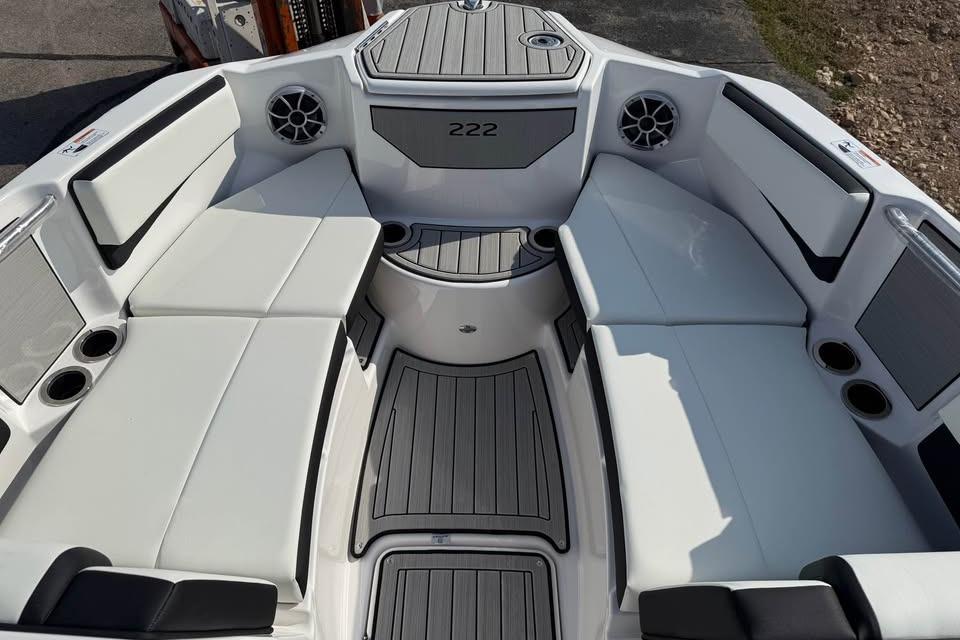 2026 Yamaha Boats 222S interior with white seating and cup holders.