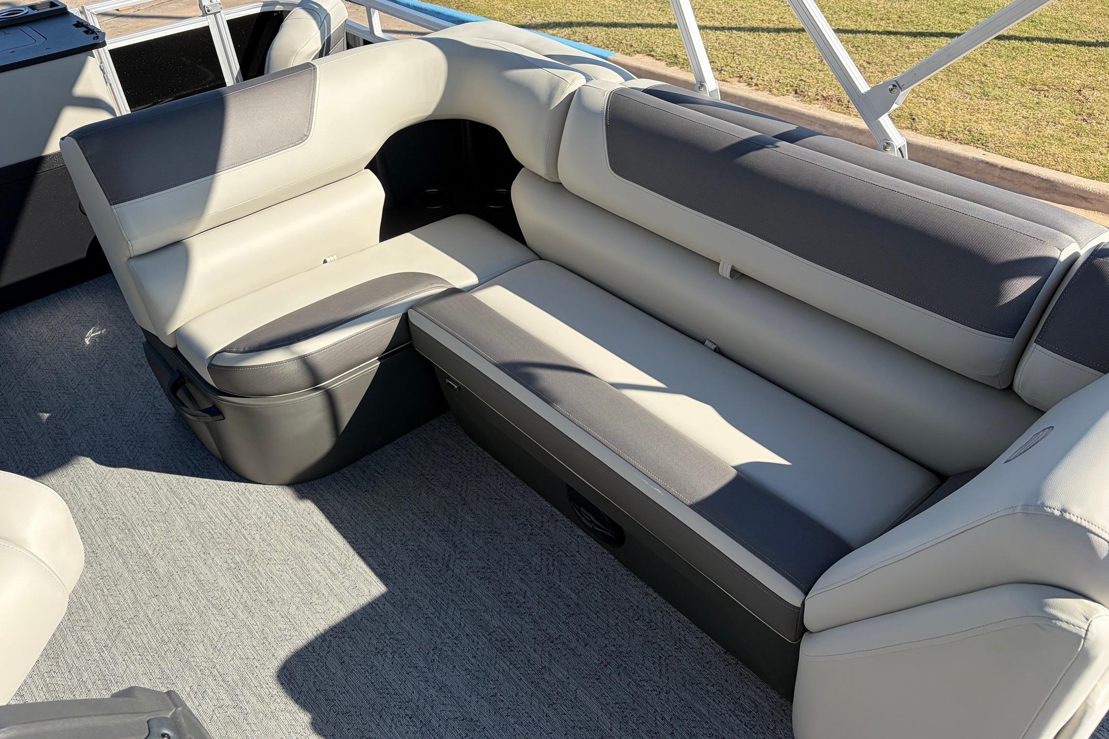 2026 Sun Tracker Fishin' Barge 22 XP3 interior seating, featuring comfortable gray upholstery.