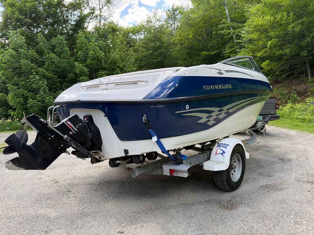 2000 Crownline 192 BR boat on trailer outdoors.