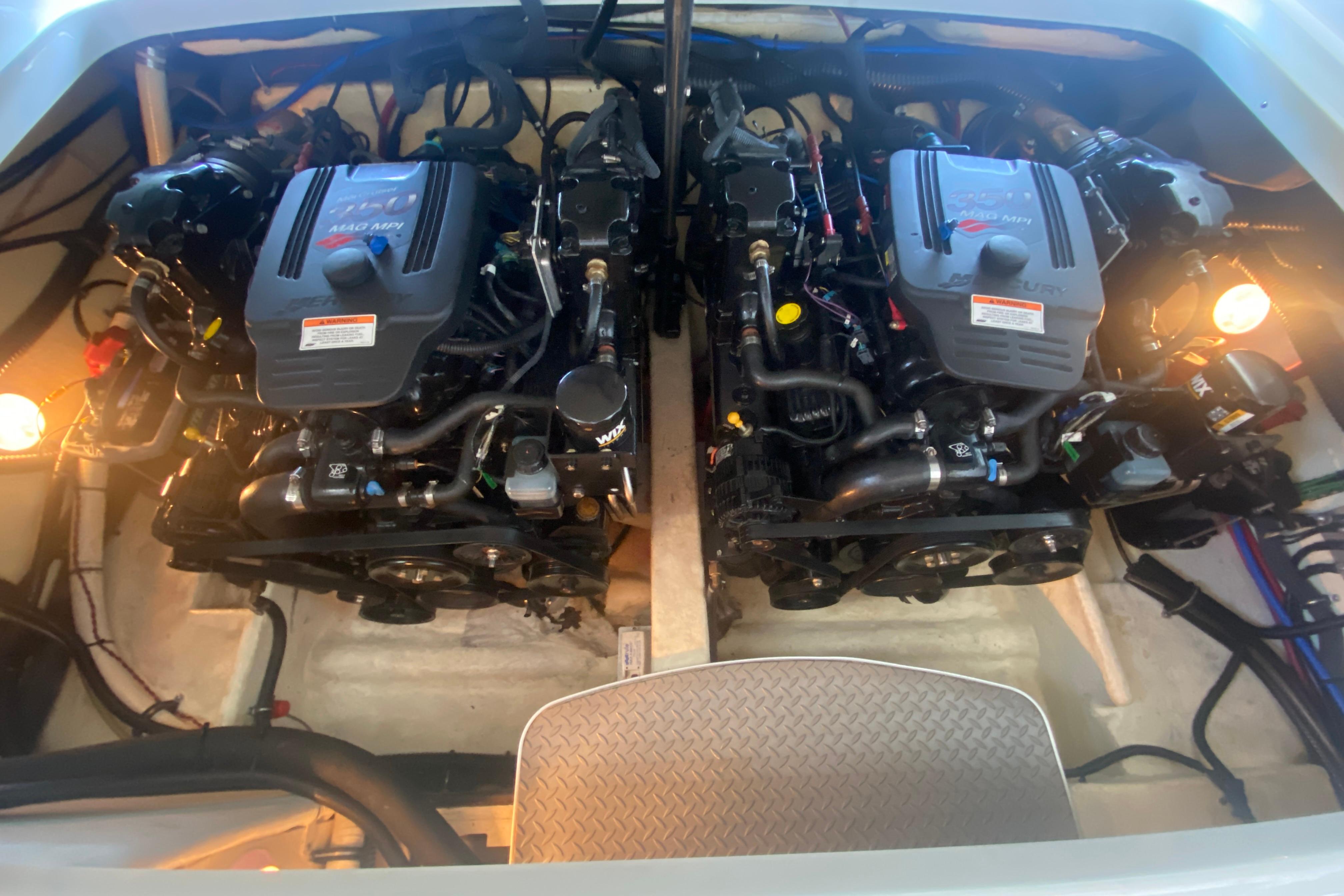 Engine compartment of a 2007 Formula 310 Sun Sport boat, featuring dual engines.