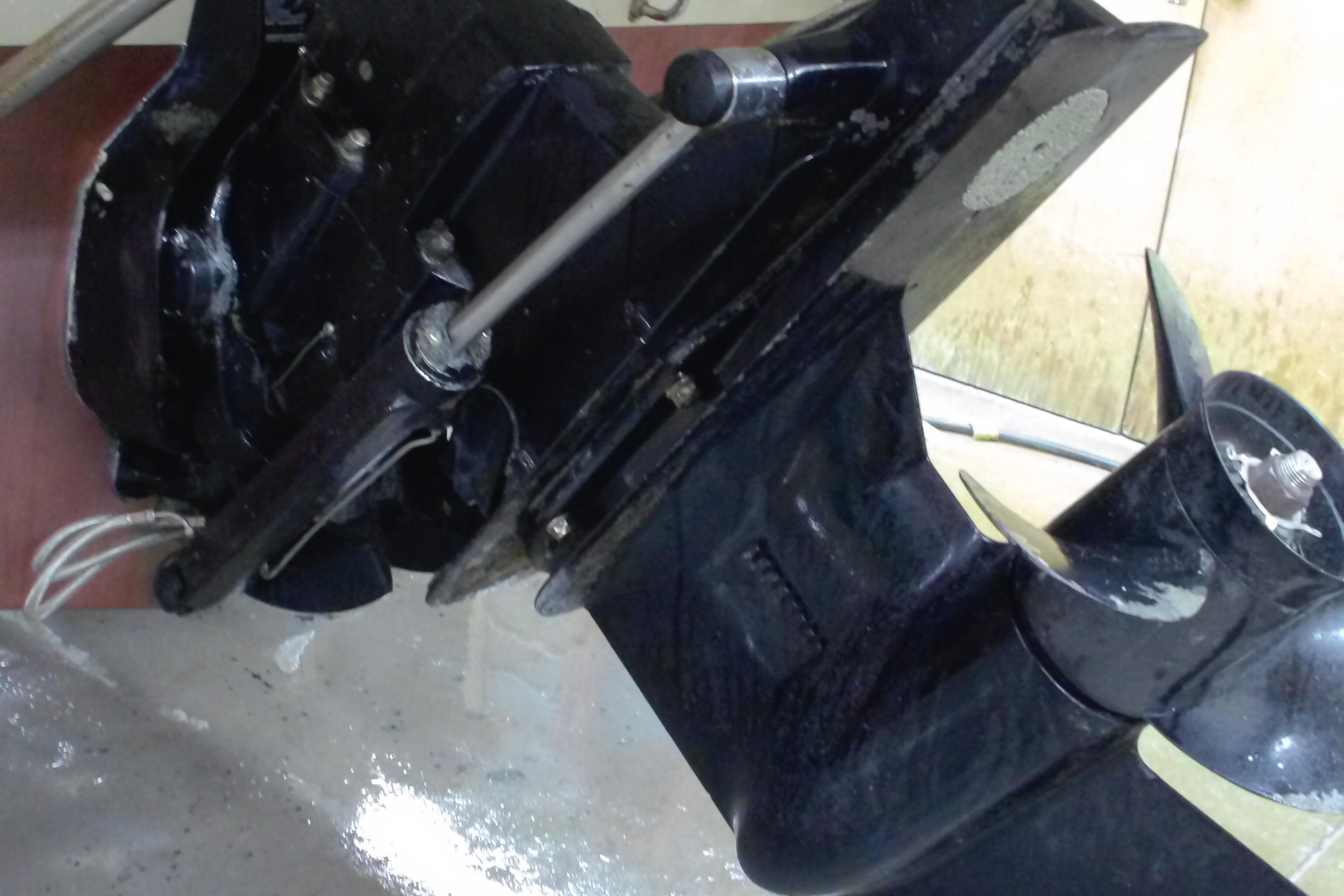 Close-up of a 2004 Trophy 2352 Walkaround boat's outboard motor and propeller.
