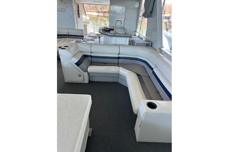 Interior of 2008 Destination Yachts 45X14 with white seating and kitchenette.