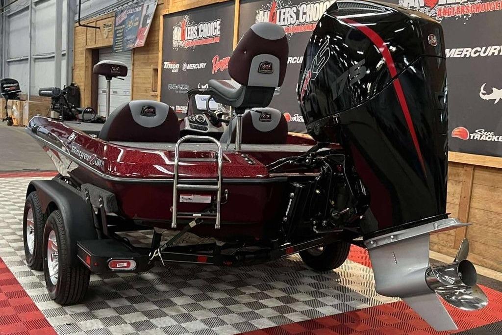 2026 Ranger Z185 boat with powerful outboard motor on display indoors.
