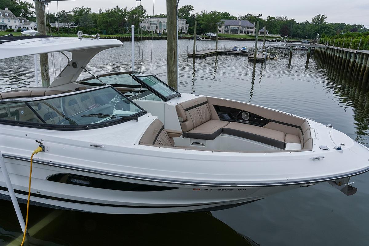 2018 Sea Ray SLX 350 boat docked in a serene marina setting.