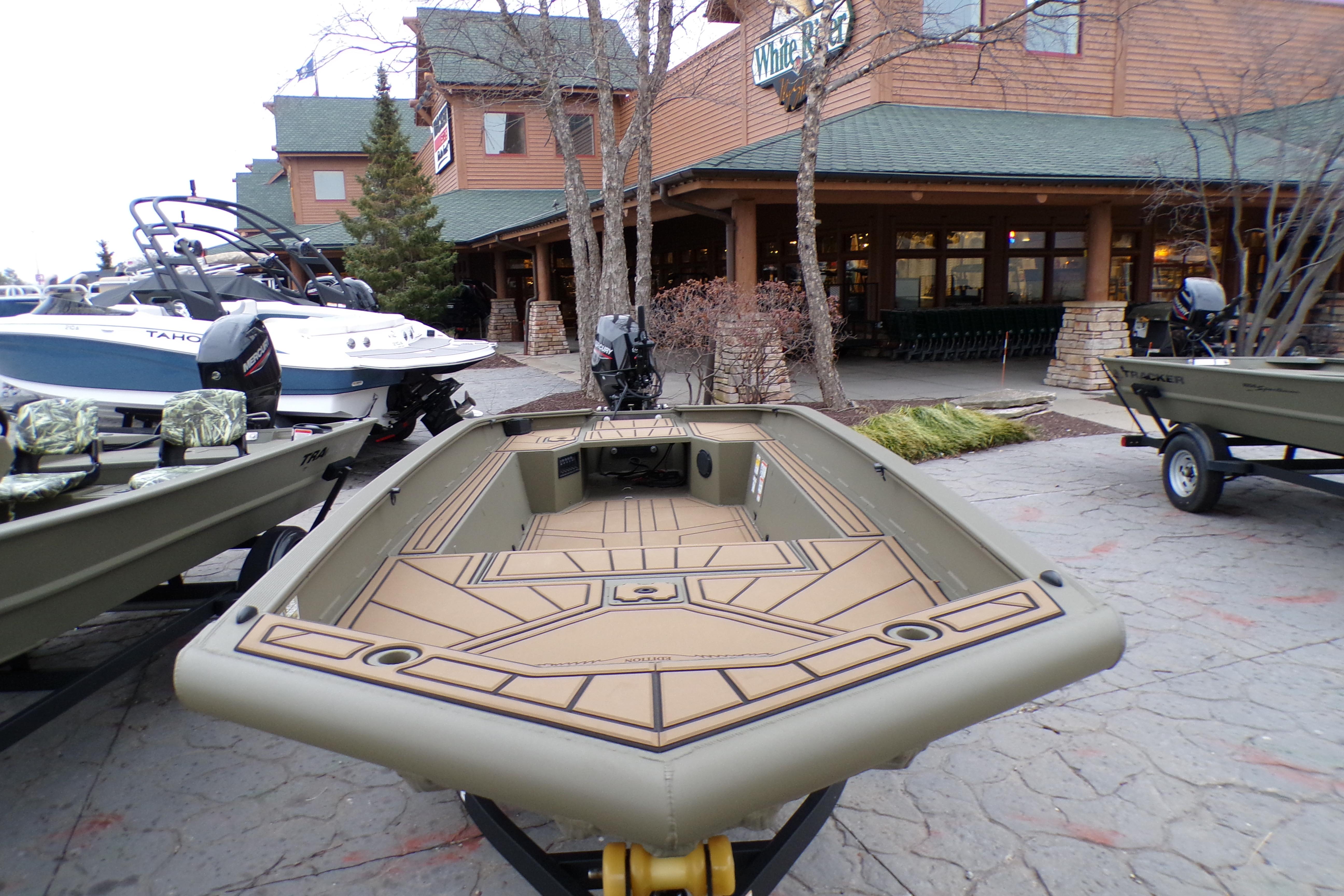 2026 Tracker Grizzly 1650 T Prairie Wings Edition boat displayed outdoors.