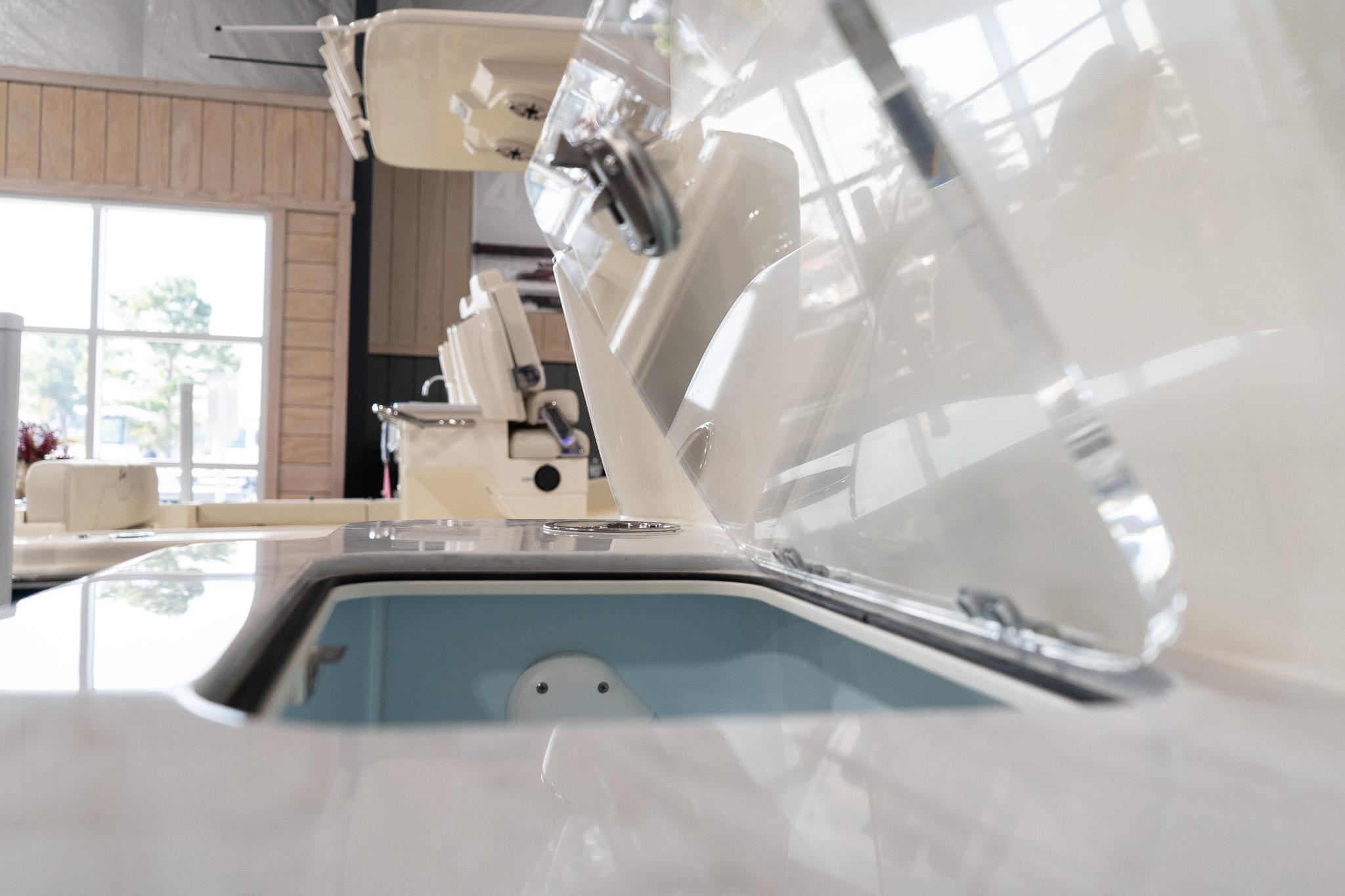 2025 Scout 261 XSS boat interior detail with open storage compartment.