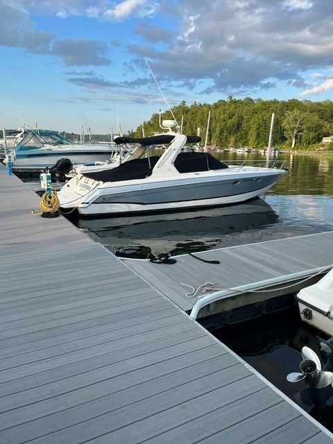 2006 Formula 330 Sun Sport docked on a sunny day.