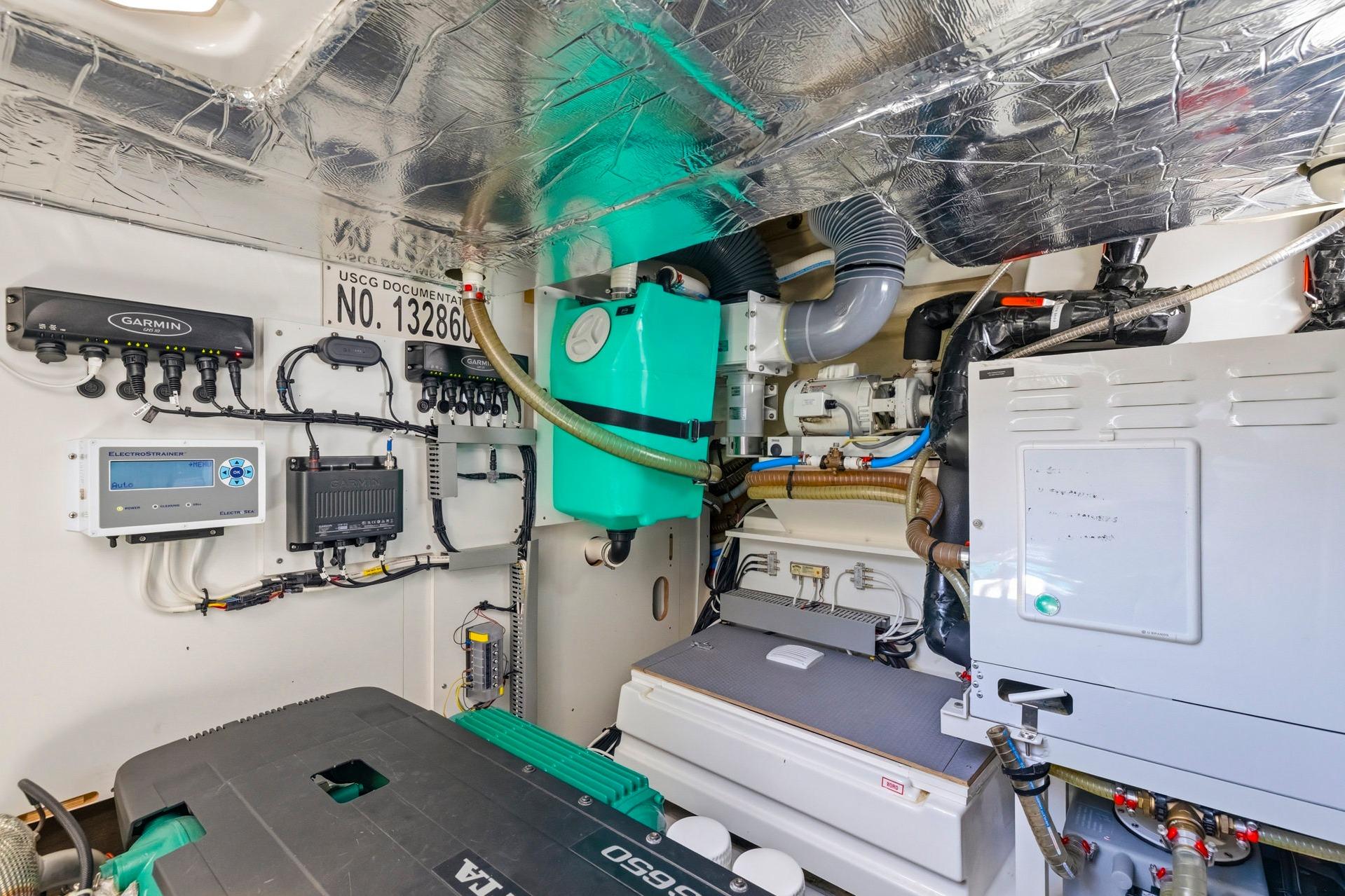 Engine room of 2022 Prestige 520 yacht with advanced equipment and wiring.