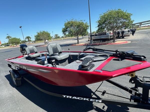 2025 Tracker Panfish 17 boat, red exterior, parked outdoors on a trailer.