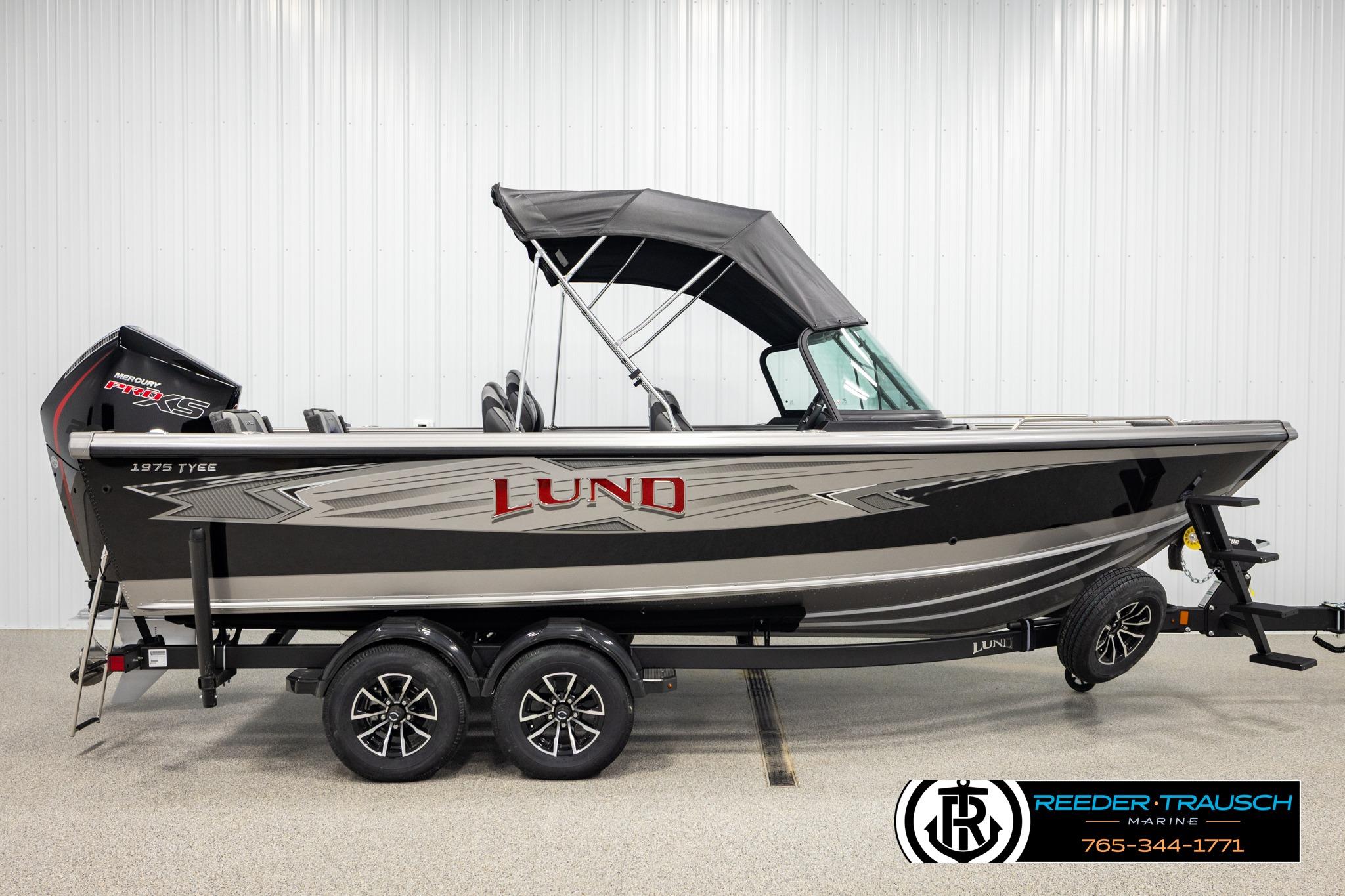 2026 Lund 1975 Tyee boat with canopy, dual axle trailer, and Mercury Pro XS engine.