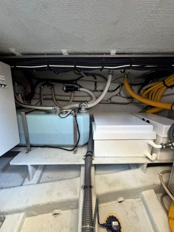 Engine room of 2022 Rodman 1290 Evolution with visible pipes and equipment.