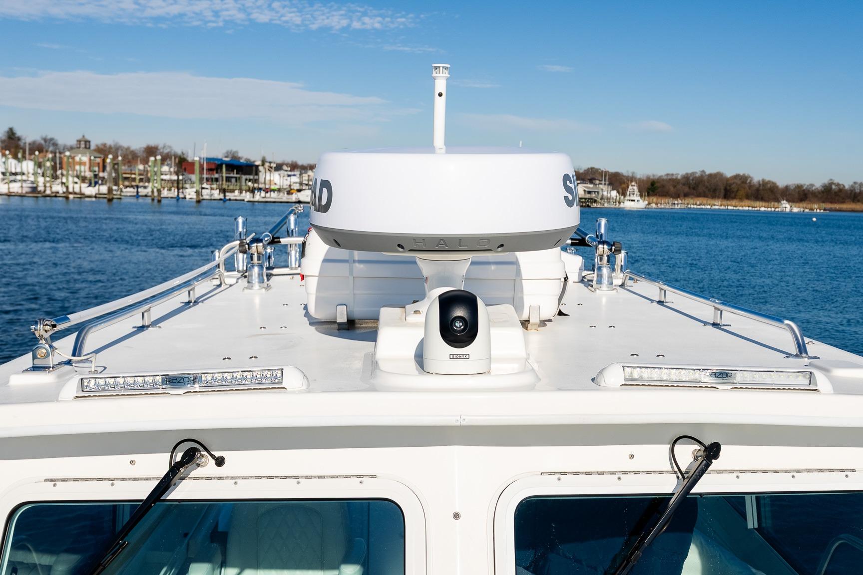 2024 Steiger Craft 31 Fisherman boat on water, featuring advanced navigation equipment.