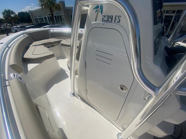 2024 Key West 239 FS boat interior with seating and storage compartments.