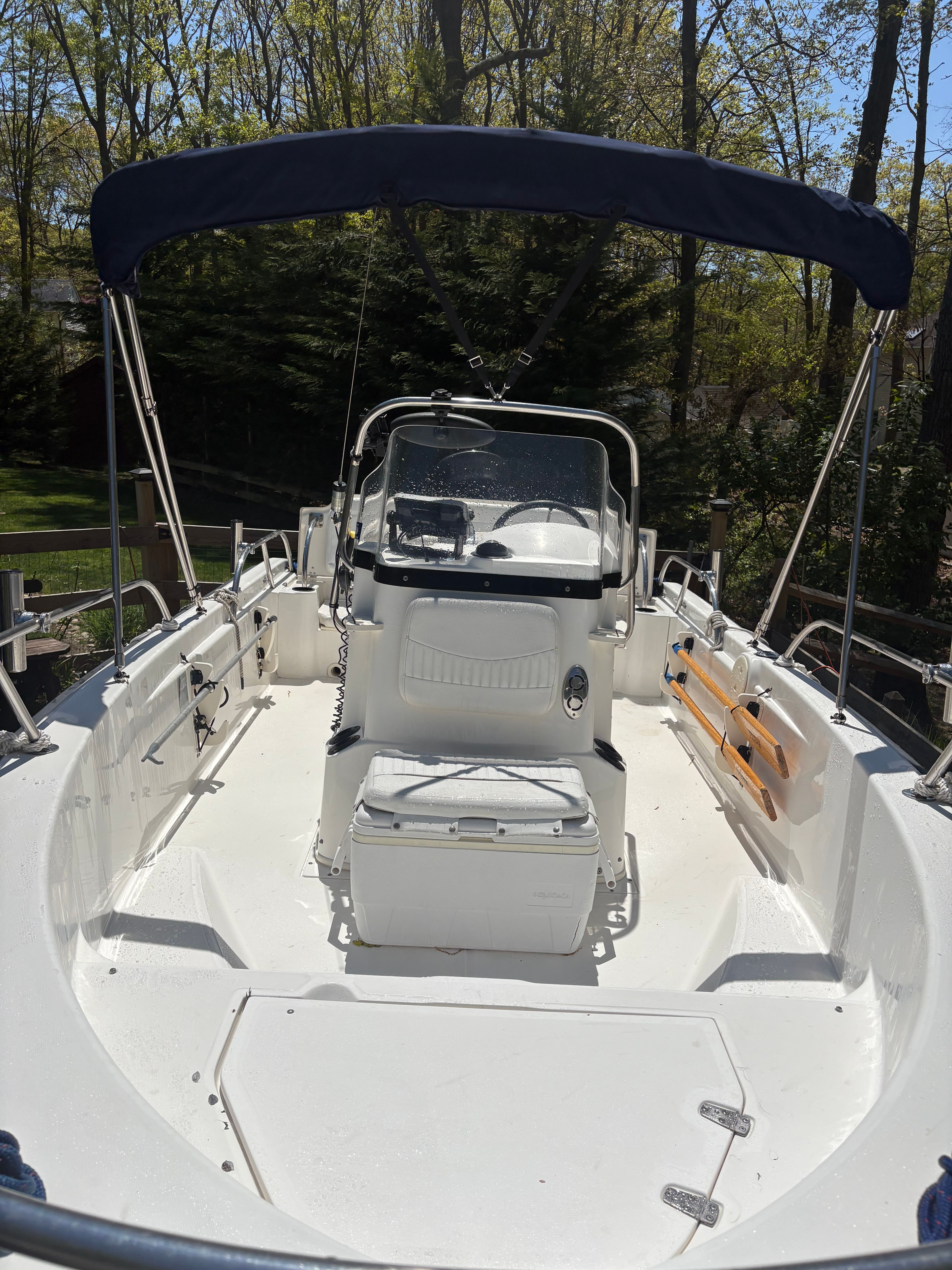 2004 Boston Whaler 180 Dauntless boat with Bimini top.
