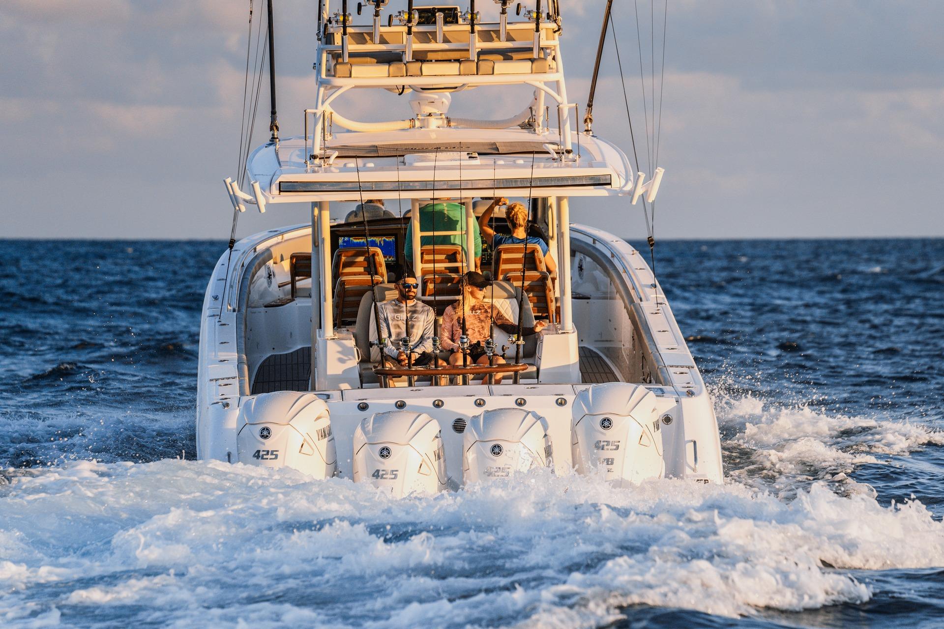 2026 Everglades 455 Center Console boat cruising on open ocean with passengers.