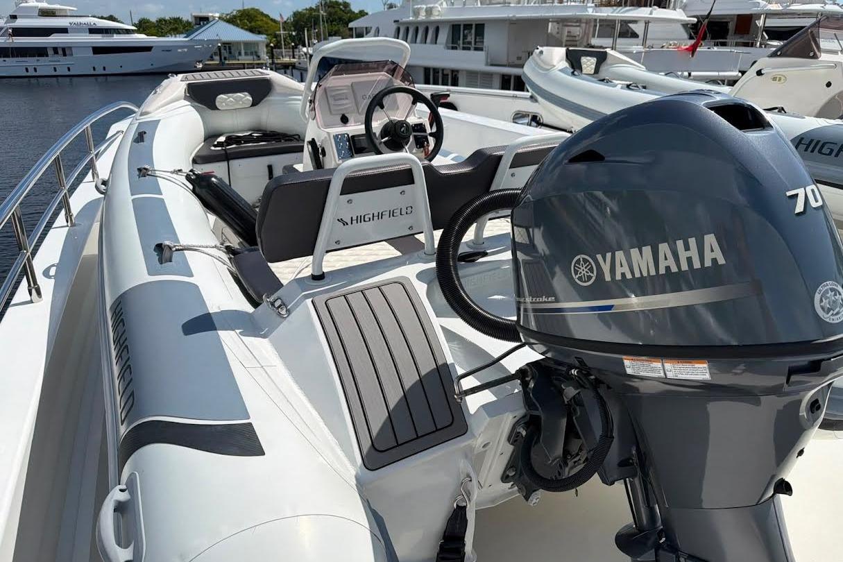 2022 Highfield Sport 420 boat with Yamaha 70 engine docked at marina.