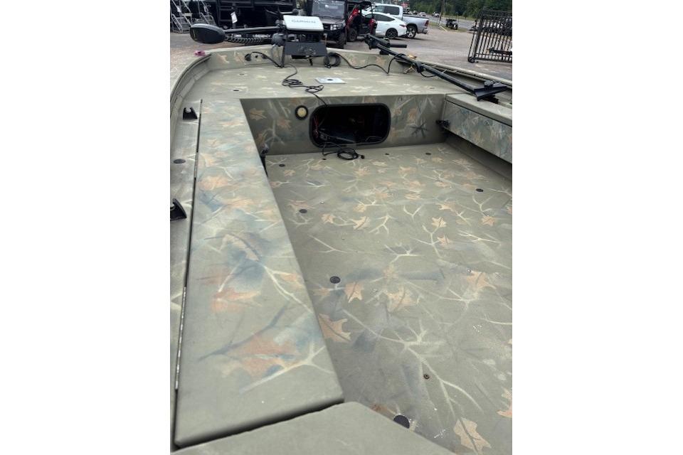 2017 Tracker Grizzly 1654 MVX Sportsman boat with camouflage interior design.