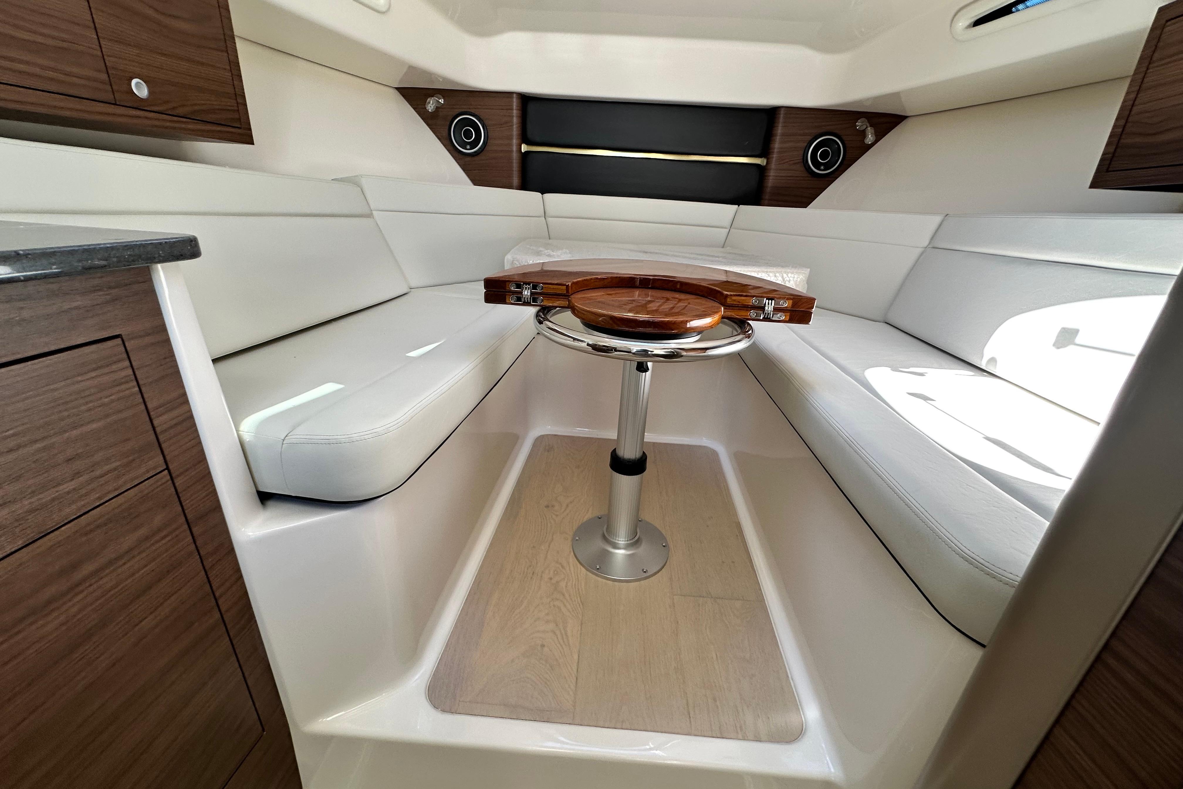 Interior of 2026 Boston Whaler 325 Conquest with elegant seating area.