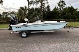 2026 Mako Pro Skiff 17 CC boat on trailer, parked outdoors.