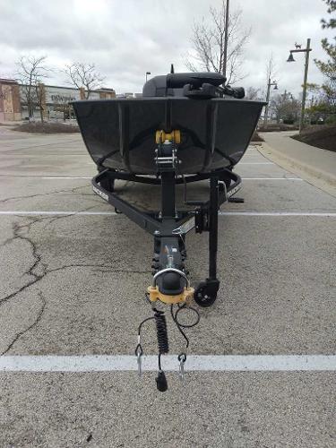 2025 Tracker Panfish 17 boat on trailer in parking lot.