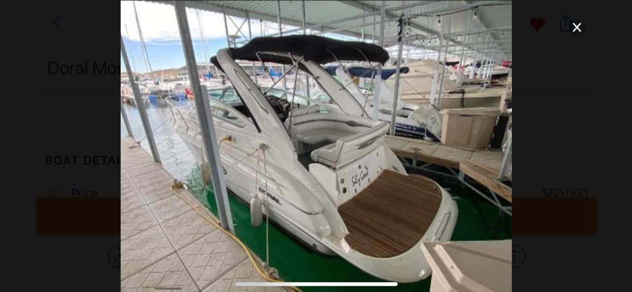 A 2007 Doral Monticello is docked in a covered marina.