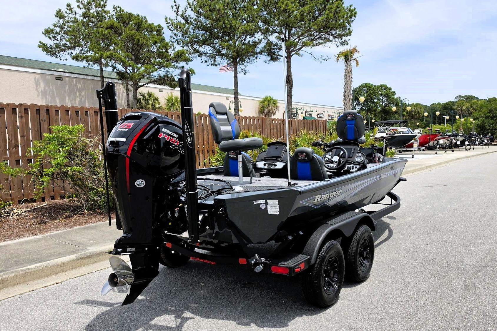 2026 Ranger RT188P boat with Mercury engine, parked outdoors on a sunny day.