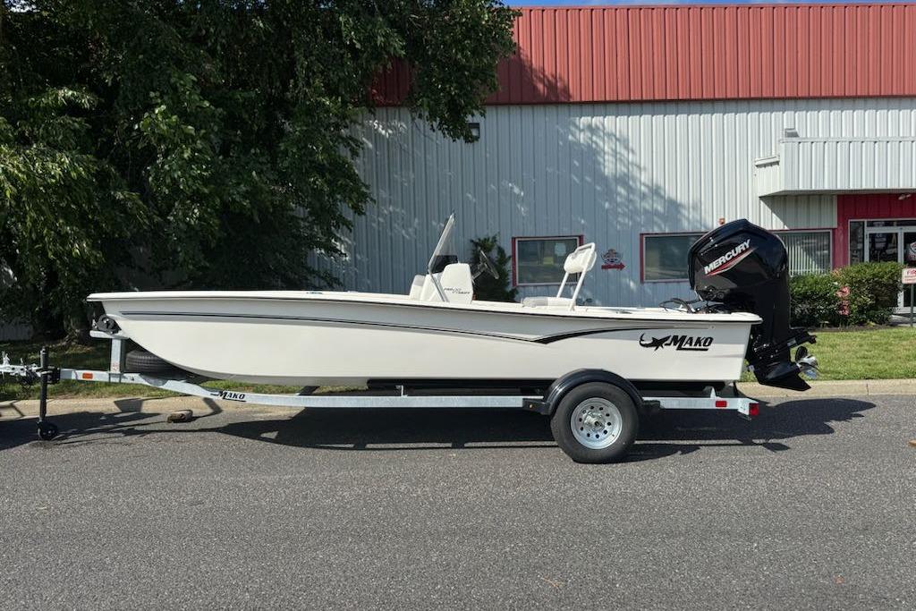 2026 Mako Pro Skiff 17 CC boat on trailer, parked outdoors.