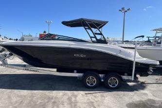 2024 Sea Ray SPX 230 boat on trailer, sleek black design, outdoor display.