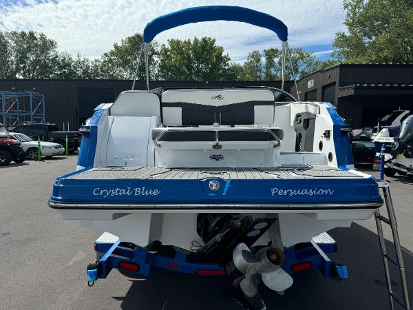 2018 Monterey 258 Super Sport boat, rear view, blue and white design, parked outdoors.
