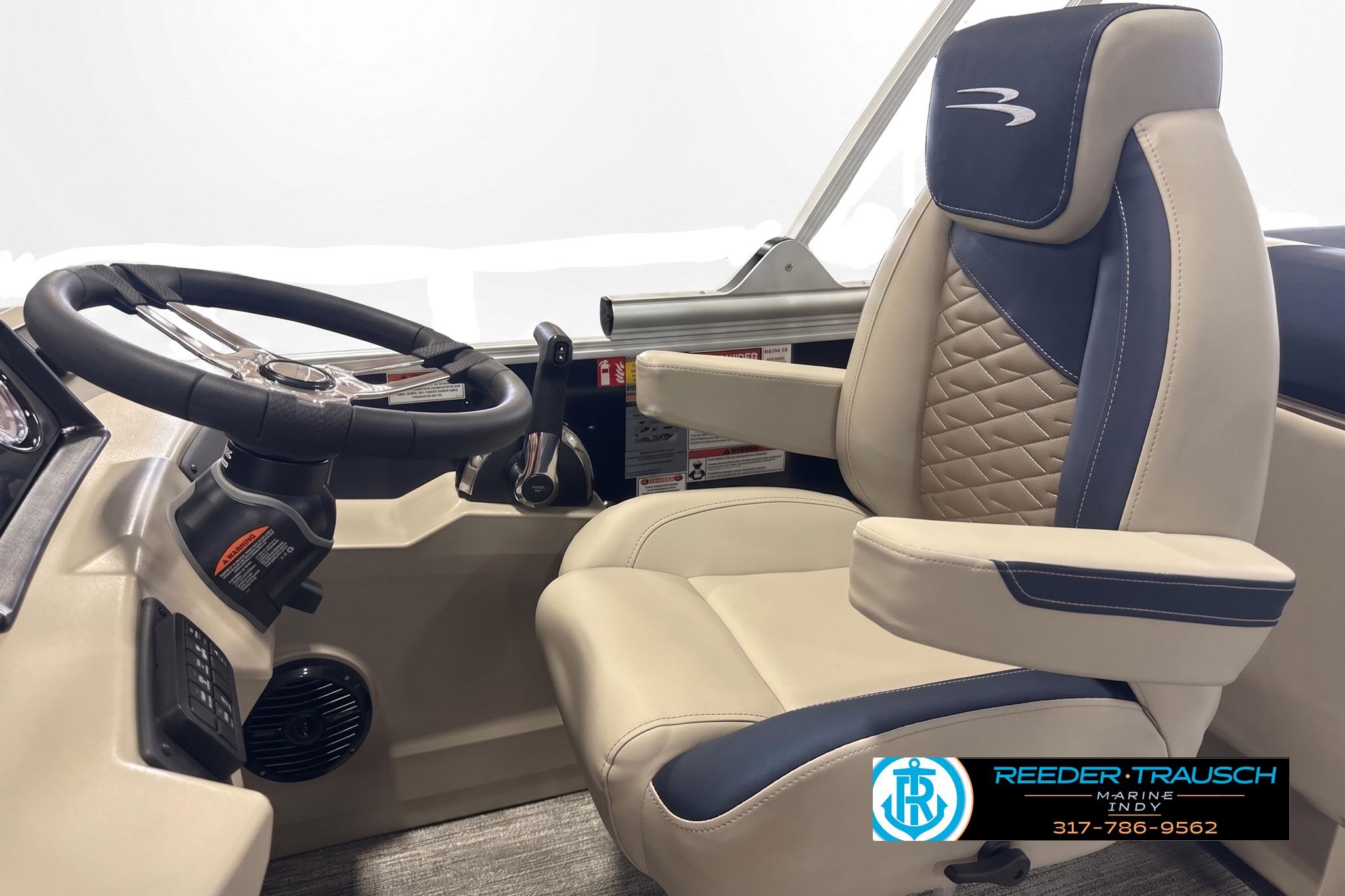 Captain's chair and steering wheel of 2027 Bennington 22 SSR boat interior.