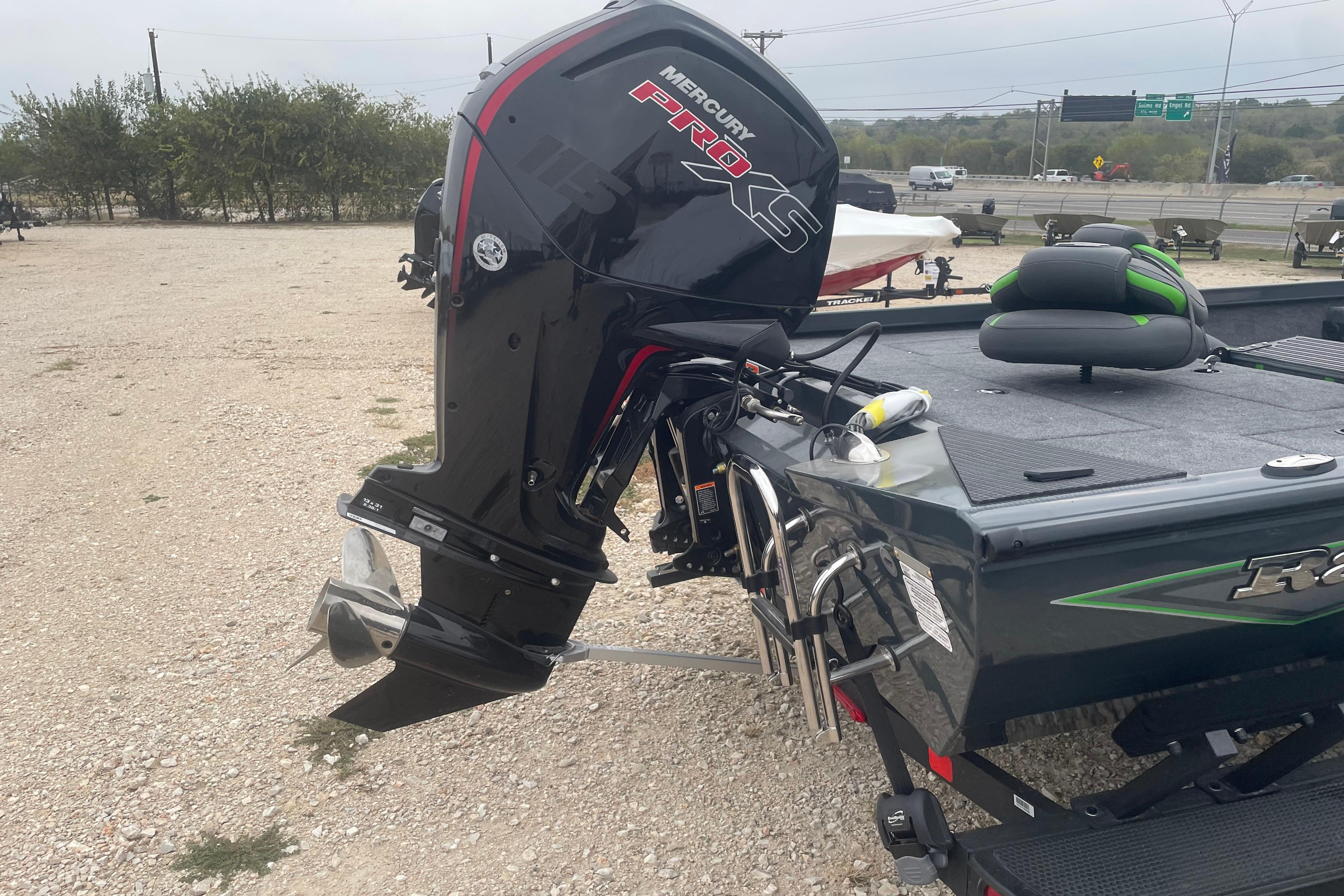 2026 Ranger RT188 boat with Mercury Pro XS outboard motor in a parking area.