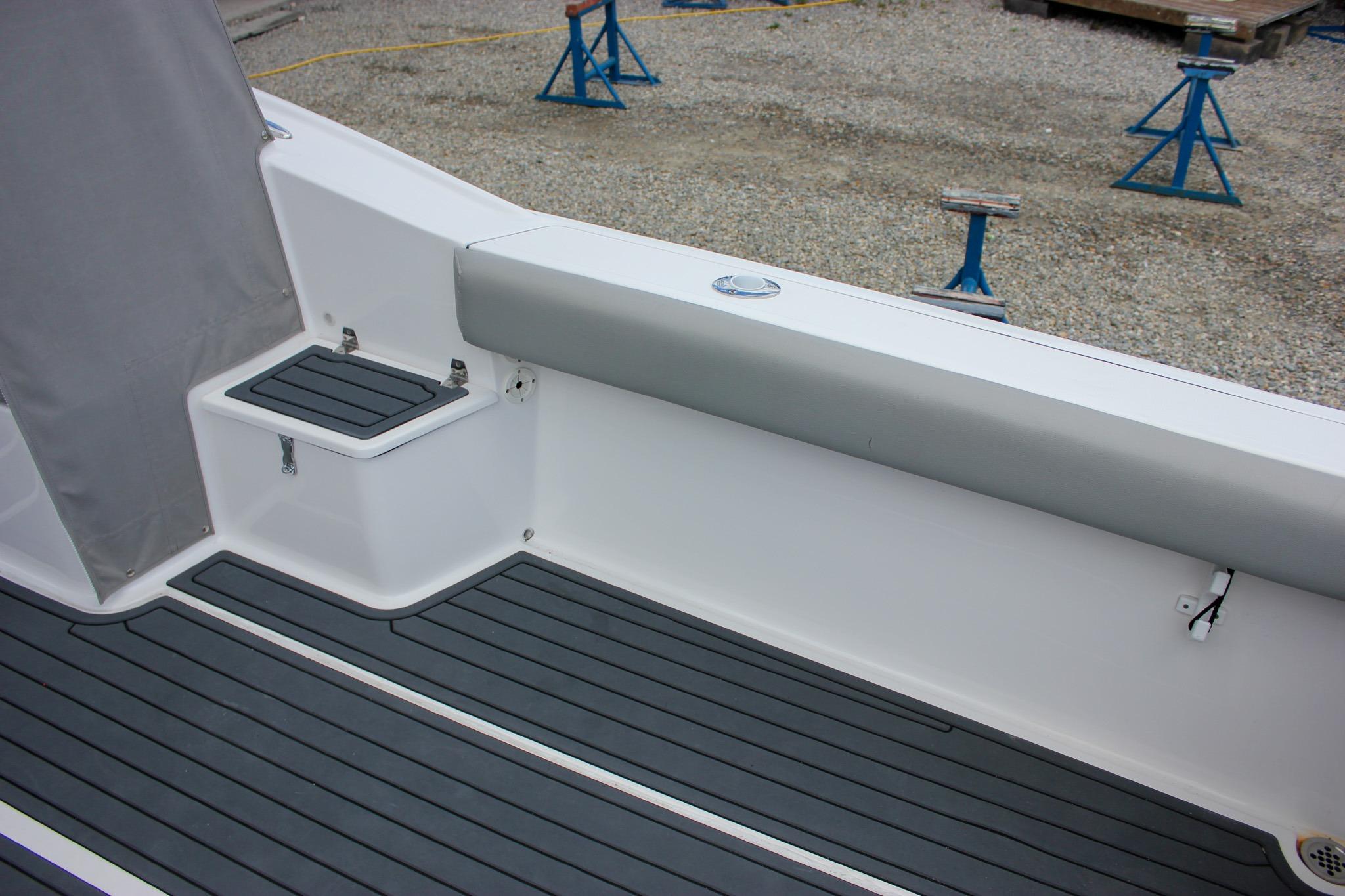 2022 NorthCoast 235 Cabin boat interior with gray seating and non-slip flooring.