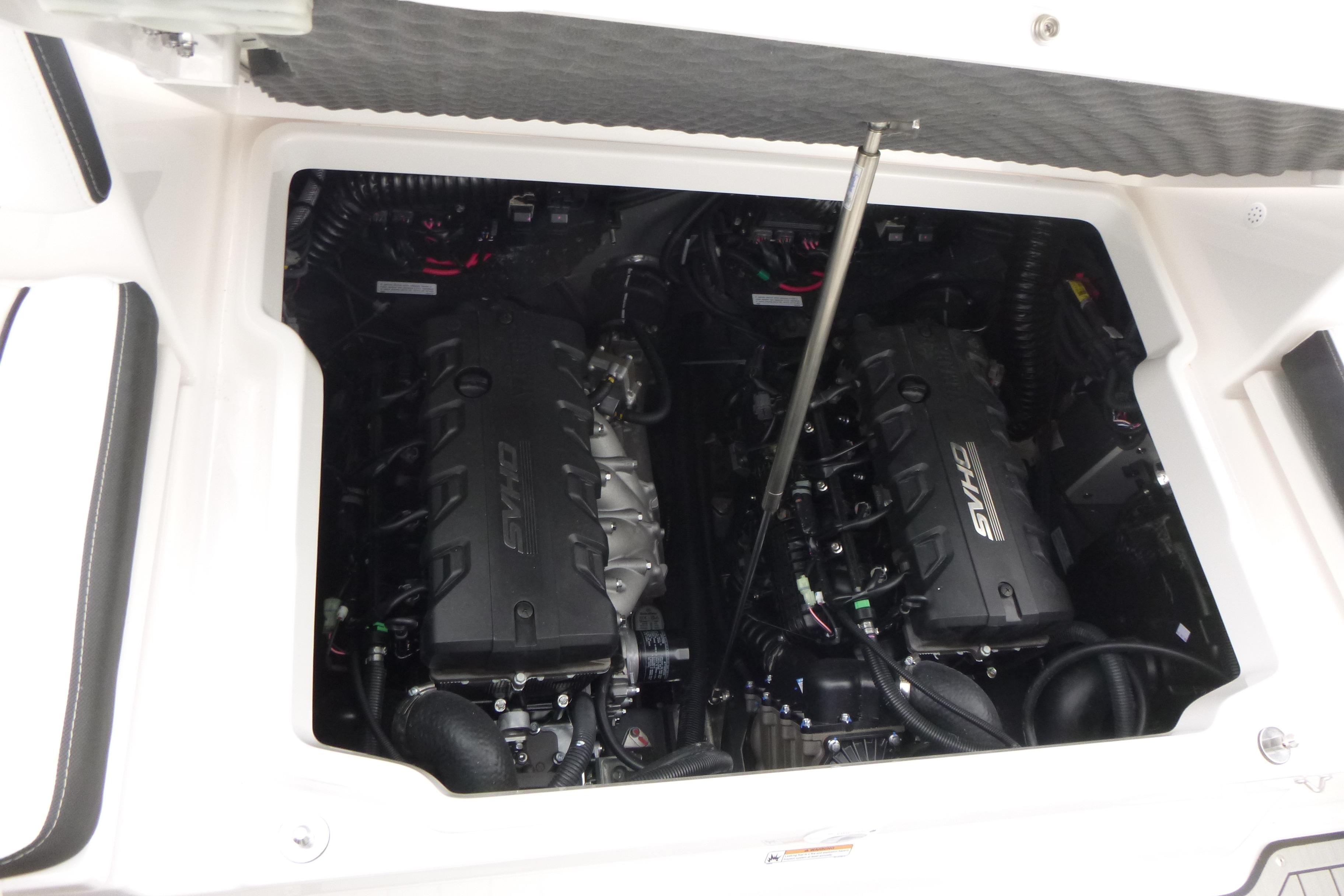 Engine compartment of 2026 Yamaha Boats 255 FSH Sport H, featuring dual SVHO engines.