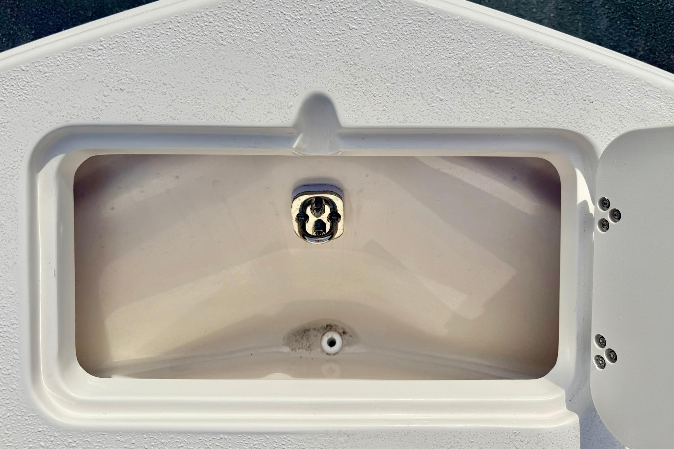 Livewell compartment on a 2026 Carolina Skiff 24 Ultra Elite boat.