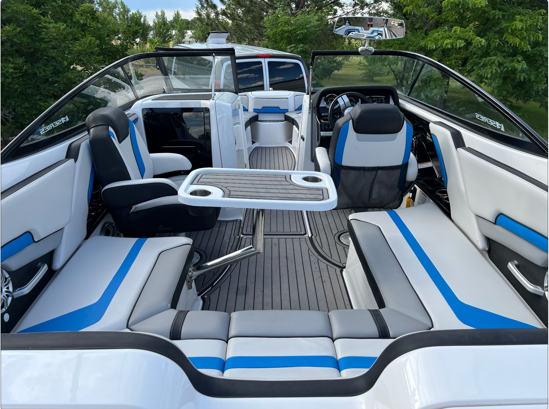 Interior of a 2017 Yamaha 242X E-Series boat with blue accents.