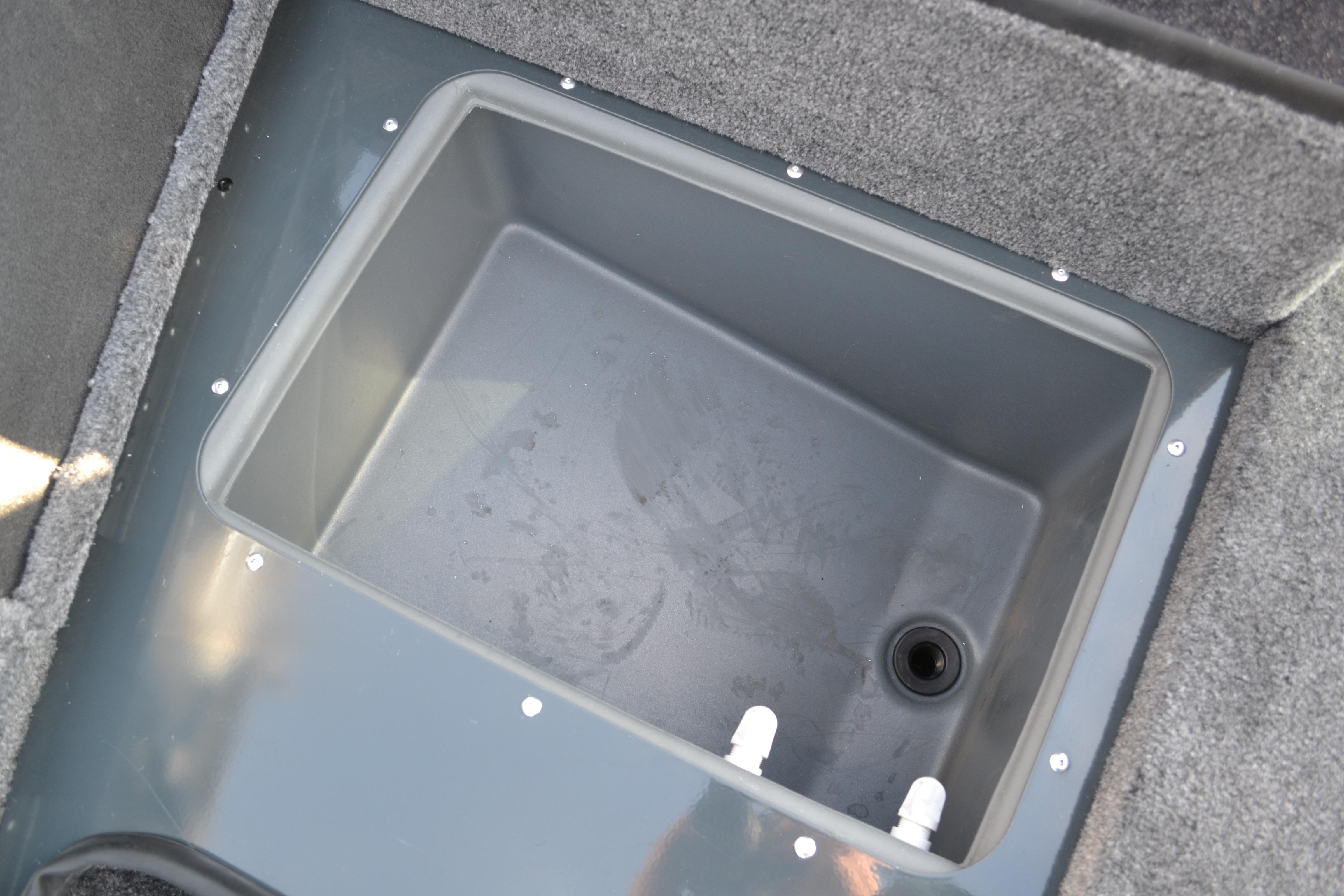 2026 Ranger VS1882SC Reata boat storage compartment with drain and fittings.