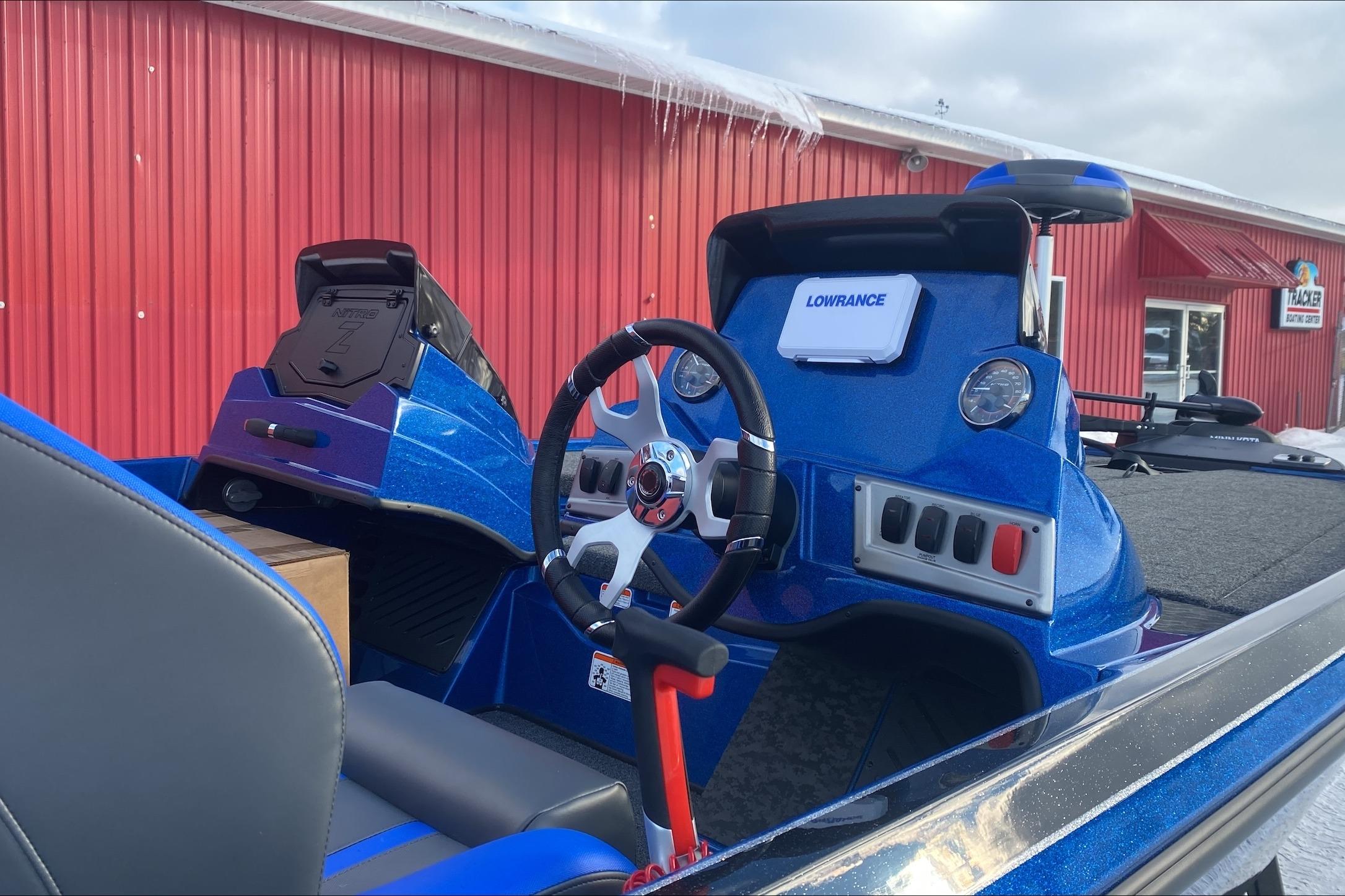 2026 Nitro Z19 XL boat interior with steering wheel and Lowrance electronics.