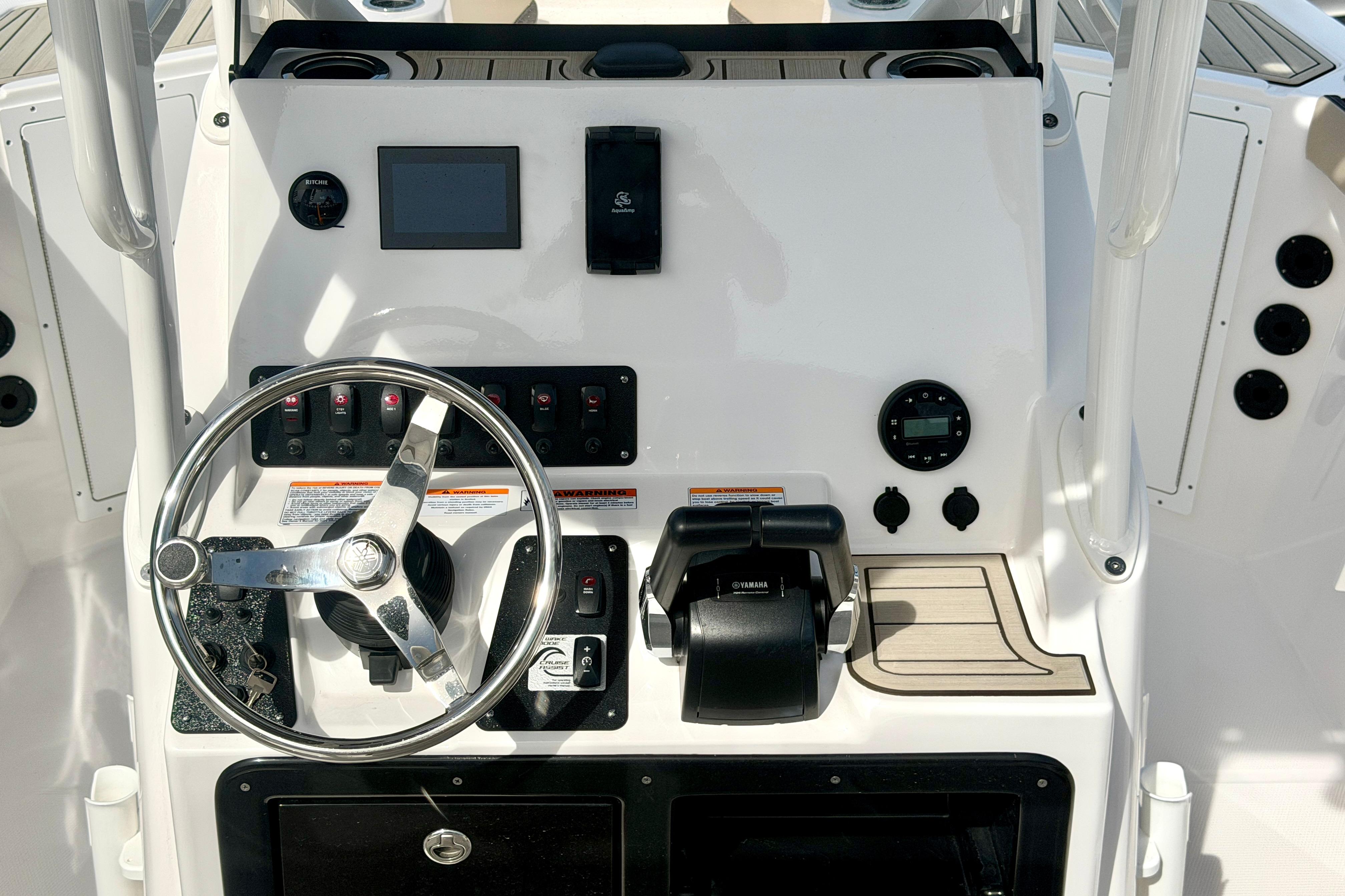 2025 Yamaha Boats 222 FSH Sport dashboard with steering wheel and controls.