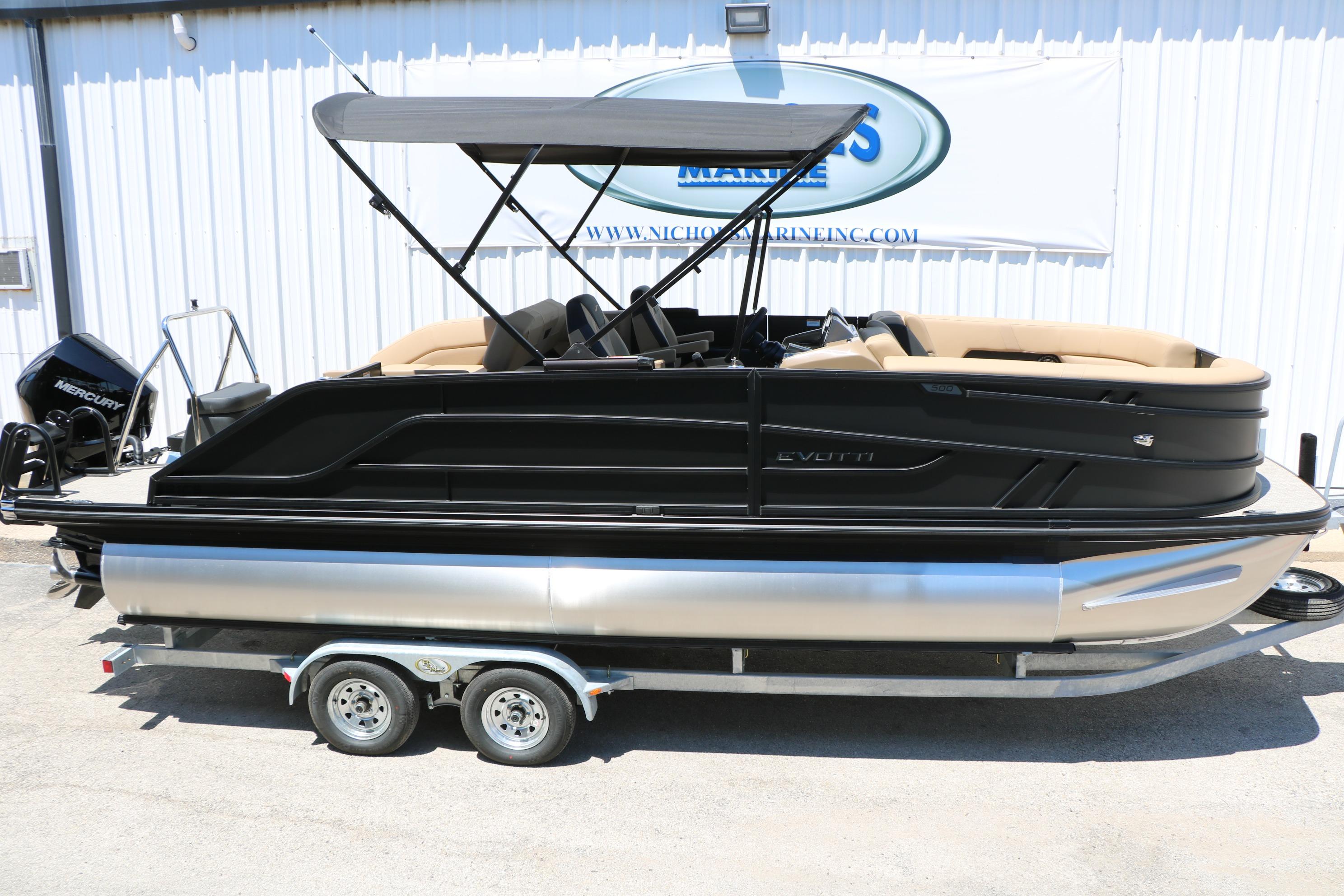 2026 Evotti 521CS pontoon boat on trailer, featuring sleek black design and canopy.