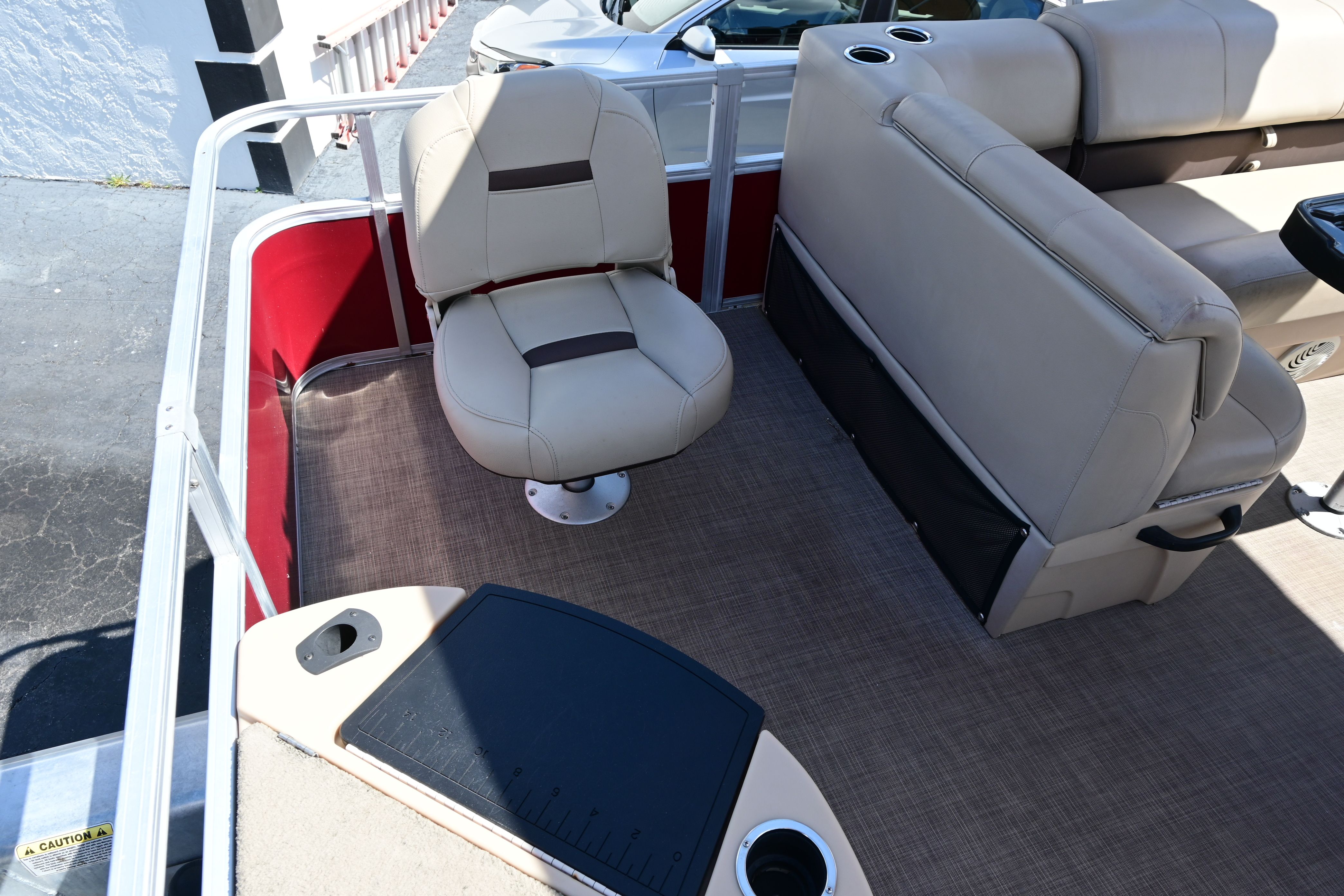 Interior of a 2019 Sun Tracker FISHI boat with beige seating.