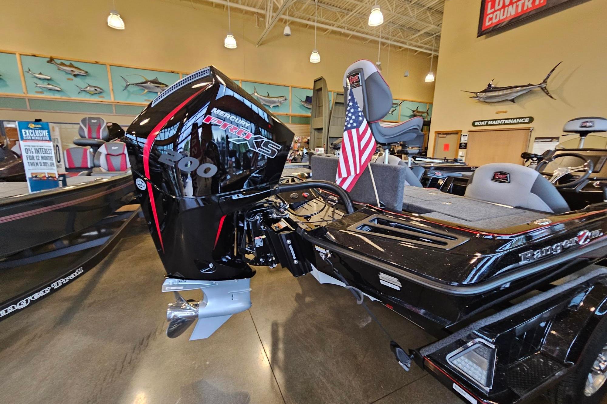 2026 Ranger Z518 Cup-Equipped boat with Mercury Pro XS engine in showroom.