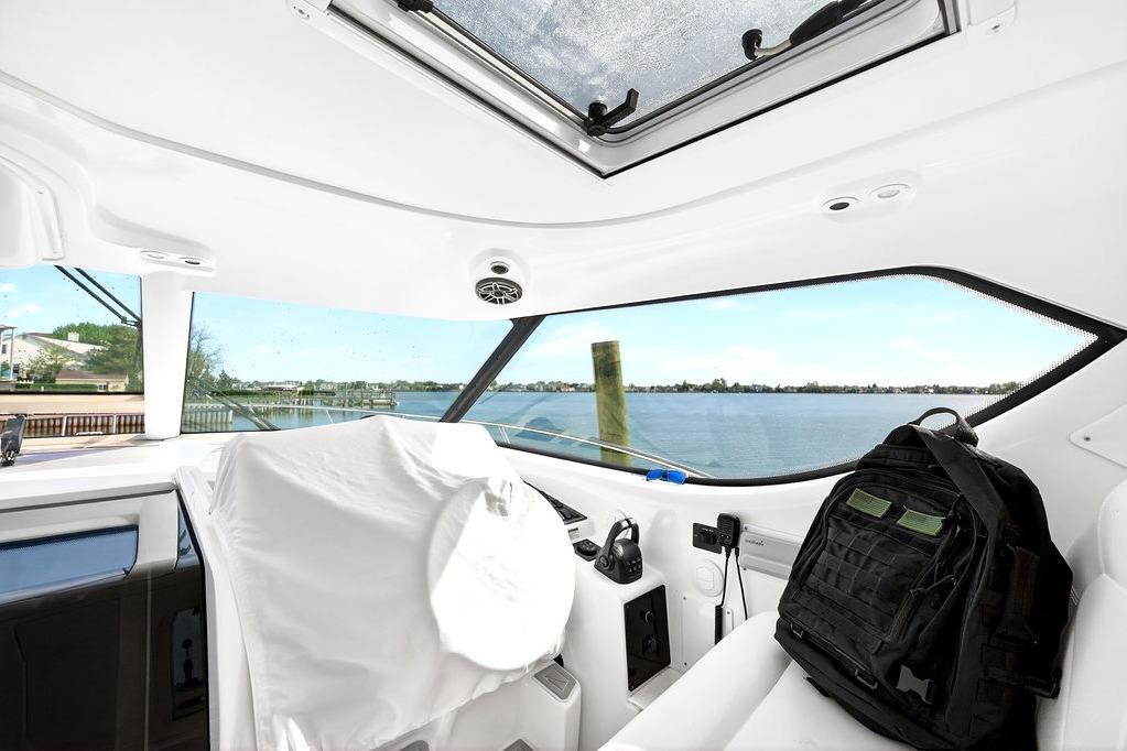 Interior view of 2006 Tiara Yachts 4300 Sovran with scenic waterfront backdrop.