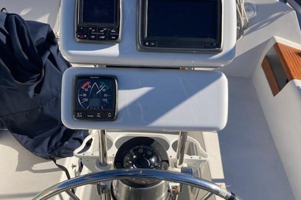 Cockpit of 1989 Catalina 30 sailboat with navigation instruments and steering wheel.
