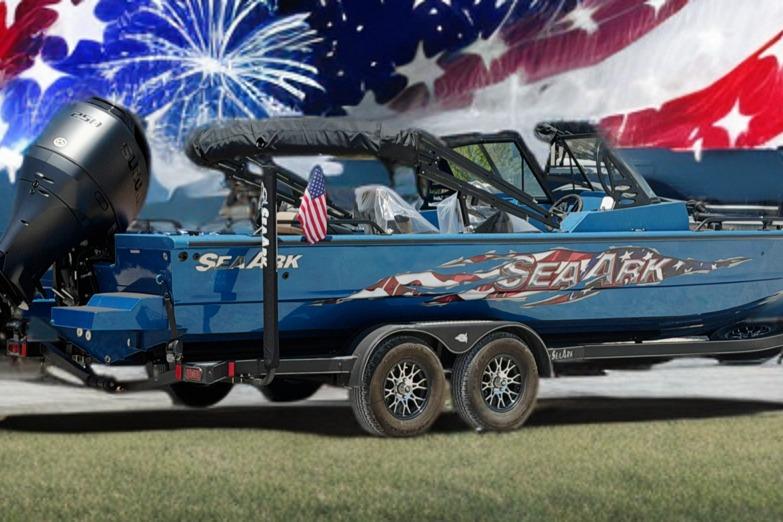 2025 SeaArk Protege 240 boat with American flag design and fireworks background.