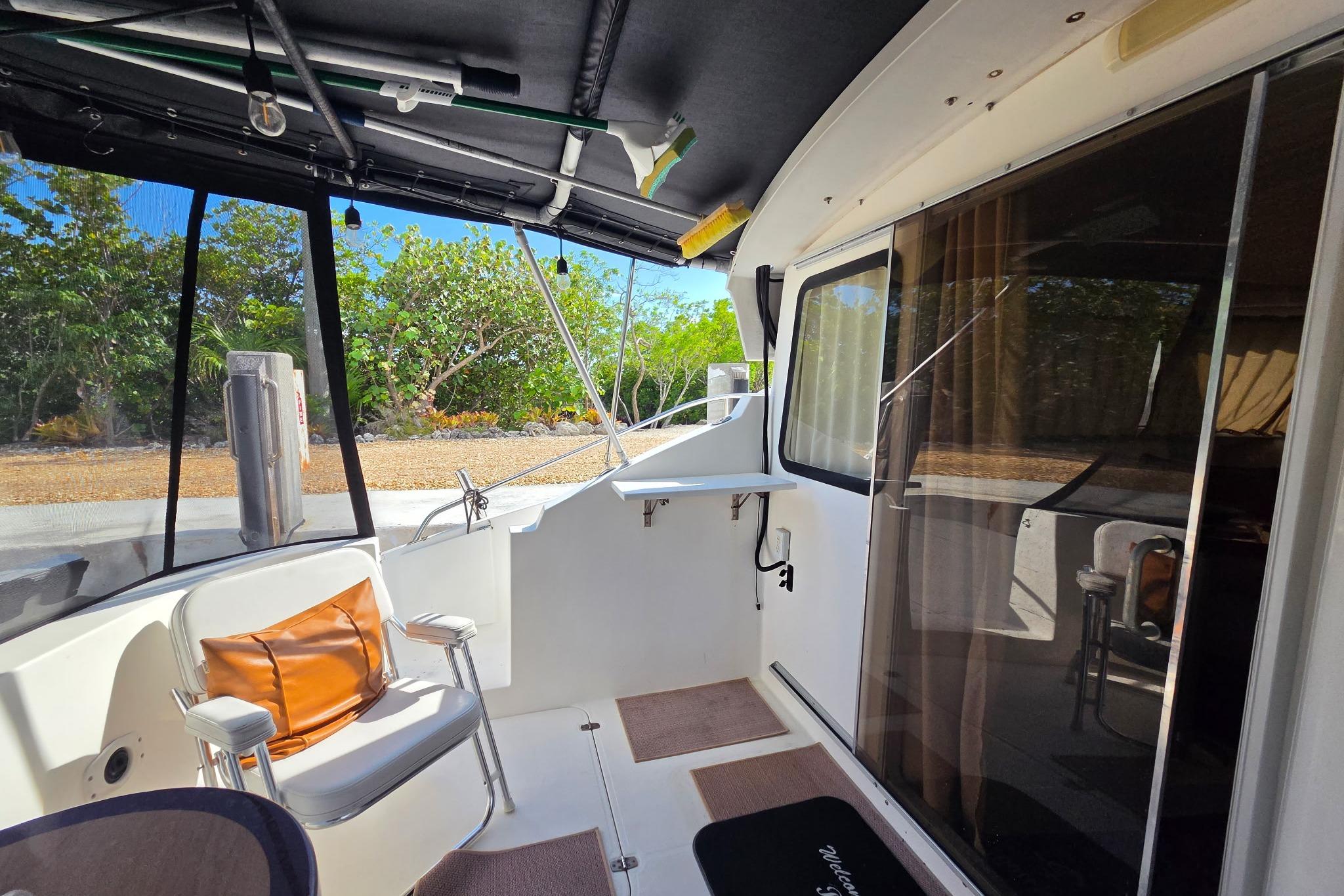 Interior view of 2000 Fountaine Pajot Maryland 37 yacht with seating and outdoor scenery.